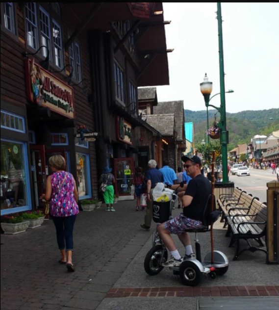 Gatlinburg Strip with a scooter.png